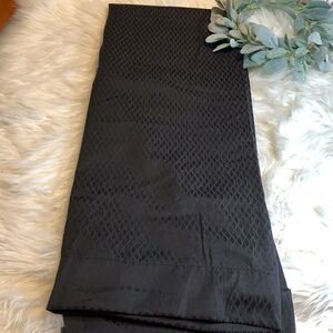 One panel of black (diamond design) black out curtains 50 x 63”